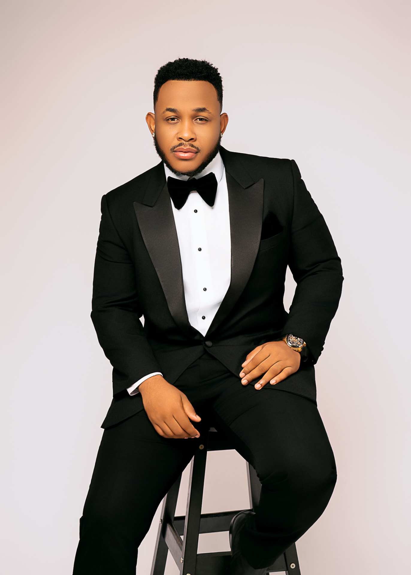 Beby Joe in a black tuxedo